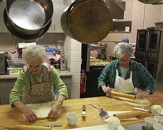 William D Lewis The Vindicator  Sue Kennedy, left, and Patty Thompson prepare kolachiat St John the Baptist Church in Campbell. Church members gathered to make to popular holiday treats 12-9-14.