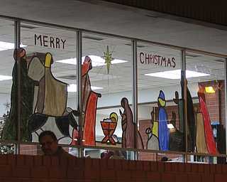 William D. Lewis The Vindicator  A nativity scene is painted on the window of the downtown Youngstown YMCA.