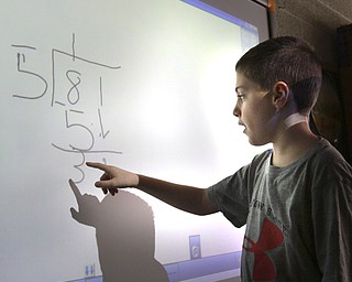 William D. Lewis the Vindicator  CH Campbell School( canfield) 4th grade student Landon Palotsee at at work on new interactive board 12.12.14