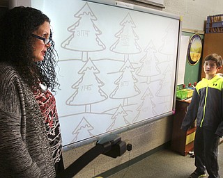 William D. Lewis the Vindicator  CH Campbell School( canfield) 4th grade teacher Dana Zarlenga-Buist and student Nicolo Cocca at work on new interactive board 12.12.14