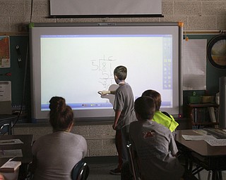 William D. Lewis the Vindicator  CH Campbell School( canfield) 4th grade student Landon Palotsee at at work on new interactive board 12.12.14