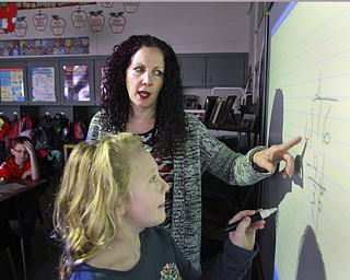 William D. Lewis the Vindicator  CH Campbell School( canfield) 4th grade teacher Dana Zarlenga-Buist and student Ashleigh Haas  at work on new interactive board 12.12.14