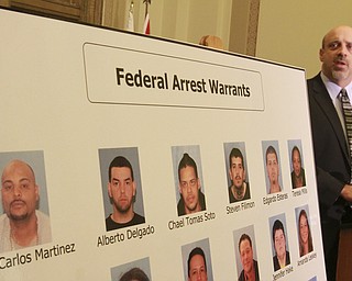 William d Lewis the vindicator  FBI agent Todd Werth speaks during a 12-10-14 news conference at City Hall about large heroin bust. Mug shots are of those indicted. Mug of  Jean Carlos Martinez is at far left. He is kingpin in the bust.