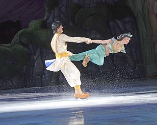 Katie Rickman | The Vindicator.Characters Aladdin and Princess Jasmine skate on the ice at the Covelli Centre for Disney On Ice on Thursday, Dec. 11, 2014.