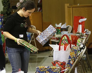        ROBERT K. YOSAY  | THE VINDICATOR..Making sure the gifts go to the right student   is  Jenny Poe....Churchill Methodist Church in Liberty - organizes, and wraps gifts for students at EJ Blott in Liberty . t