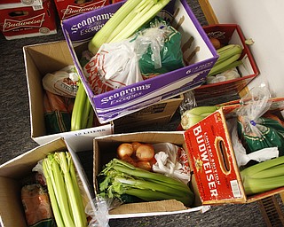        ROBERT K. YOSAY  | THE VINDICATOR.. .Canned goods, condiments, bread and boxed dinners line 12 tables inside Lake Milton Presbyterian Church..ItÕs enough to provide 20 families in the Jackson-Milton community with groceries for the holidays. .For nearly 30 years, Murle and Kaye McLaughlin have been organizing the effort to help those in need.