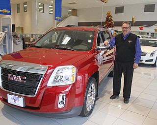        ROBERT K. YOSAY  | THE VINDICATOR..Holiday Car Deals - as Dave Urban at Stadium Superstore..in Salem   talks about the great leasing deals for the GMC Terrain.