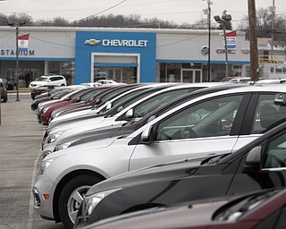        ROBERT K. YOSAY  | THE VINDICATOR..Holiday Car Deals -the chevy cruze... sits outside the Stadium Superstore in Salem