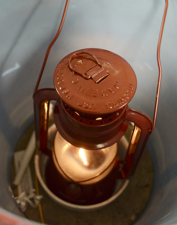 Katie Rickman | The Vindicator.The Peace Light is stored in a bucket on Friday, December 12, 2014 at the Greater Wester Reserve Council of Boy Scouts in Warren.