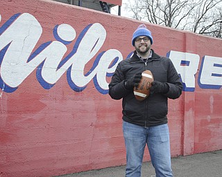 Katie Rickman | The Vindicator.Brian Goodwin of Charlotte, NC is writing and producing a documentary for ESPN about Bo Rein, he stands in front of the Niles stadium wall on Dec. 12, 2014.