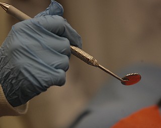        ROBERT K. YOSAY  | THE VINDICATOR..using a mouth mirror ..YSUÕs Health Professions Affinity Community is an initiative to increase the diversity of the primary healthcare and dental workforce in the Mahoning Valley by encouraging high school students to prepare for careers in health professions.