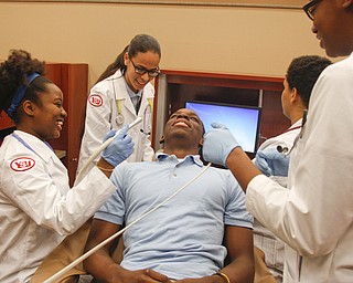        ROBERT K. YOSAY  | THE VINDICATOR..East High Schools  junior Zaria Love  Vivianjelys Rodriquez 10th Kyron Lee ( chair) Senior-  Davon Ashford 11th  and Savannah Sockwell12th ..YSUÕs Health Professions Affinity Community is an initiative to increase the diversity of the primary healthcare and dental workforce in the Mahoning Valley by encouraging high school students to prepare for careers in health professions.