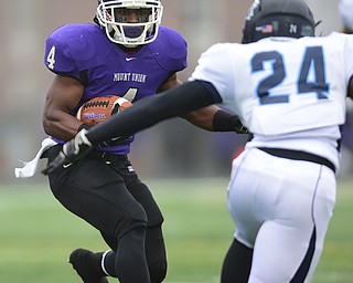 ALLIANCE, OHIO - DECEMBER 13, 2014: Bradley Mitchell #4 of Mount Union runs the football in the open field attempting to avoid Joe Brown #24 of Wesley during the 1st half of Saturday afternoons game at Mount Union Stadium. Mount Union won 70-21. (photo by David Dermer/Youngstown Vindicator)