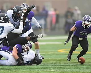 ALLIANCE, OHIO - DECEMBER 13, 2014: Alex Kocheff #31 of Mount Union prepares to dive on the loose football after Mike Jackson #47 forced a fumble by hitting Robert Wiggs #6 of Wesley on a kickoff during the 1st half of Saturday afternoons game at Mount Union Stadium. Mount Union won 70-21. (photo by David Dermer/Youngstown Vindicator)