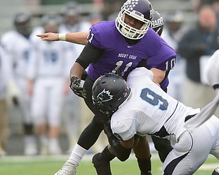 ALLIANCE, OHIO - DECEMBER 13, 2014:Taurice Scott #11 of Mount Union fumbles the football while being hit by Aamir Petrose #6 of Wesley during the 1st half of Saturday afternoons game at Mount Union Stadium. Mount Union won 70-21. (photo by David Dermer/Youngstown Vindicator)
