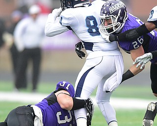 ALLIANCE, OHIO - DECEMBER 13, 2014: Andrew Monaghan #84 of Wesley is tackled by Alex Kocheff #31 and Nick Rodriguez #26 of Mount Union during the 1st half of Saturday afternoons game at Mount Union Stadium. Mount Union won 70-21. (photo by David Dermer/Youngstown Vindicator)