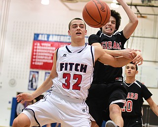 POLAND, OHIO - DECEMBER 13, 2014: Dominic DiFrancesco #32 of Fitch and Dylan O'Hara #15 of Girard battle for a loose ball under the Fitch basket during the 2nd half of Saturday afternoons game at Poland High School. (Photo by David Dermer/Youngstown Vindicator)