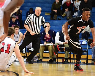 POLAND, OHIO - DECEMBER 13, 2014: DeOnte Brown #3 of Girard dribbles away from Anthony Pangio #11 of Fitch after firing a turnover during the 2nd half of Saturday afternoons game at Poland High School. (Photo by David Dermer/Youngstown Vindicator)