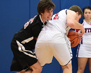 POLAND, OHIO - DECEMBER 13, 2014: Dylan O'Hara #15 of Girard and Anthony Pangio #11 of Fitch battle before a jump ball call during the 2nd half of Saturday afternoons game at Poland High School. (Photo by David Dermer/Youngstown Vindicator)