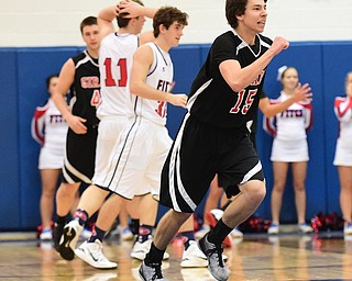 POLAND, OHIO - DECEMBER 13, 2014: Dylan O'Hara #15 of Girard pumps his fist after a missed Fitch shot that would have forced overtime after the 2nd half of Saturday afternoons game at Poland High School. (Photo by David Dermer/Youngstown Vindicator) Brian Beany #33, Anthony Pangio #11 of Fitch and Tyler Kilbourne #42 of Girard pictured.