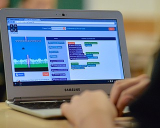 Jeff Lange | The Vindicator  A child's laptop screen shows the website that was being used by the 8th grade class during the Hour of Code, Wednesday morning at Boardman Middle School. Children would drag and drop blocks to program their own version of Flappy Birds.