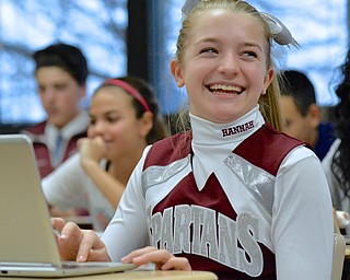 Jeff Lange | The Vindicator  Hannah Greene (14), eighth grader at Boardman Middle School, smiles as she finds a glitch in the code of her Flappy Birds game, Wednesday afternoon at Boardman Middle School during the Hour of Code.