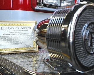 Jeff Lange | The Vindicator  Firefighter/EMT-P Janett Ziegler's Life Saving Award certificate she earned by saving the life of Poland resident Jack Malloy with the help of Abigail Cline, Kyle Conklin and Nicholas Graf.