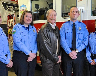 Jeff Lange | The Vindicator  Members of the Poland FD Kyle Conklin and Abigail Cline (left) and Nicholas Graf and Janet Ziegler (right) stand with heart attack survivor Jack Malloy (center), Wednesday afternoon at the Poland Fire Department.