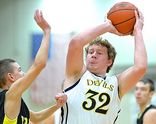 Jeff Lange | The Vindicator  Matthew Howard (32) searches for an open teammate as he is pressured by a Bristol defender during first half action of Saturday night's game in Struthers as part of the Hope Classic Showcase.