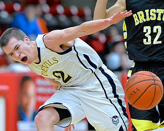 Jeff Lange | The Vindicator  Devils' Anthony Pugh (2) loses the ball as he trips during first period action at Struthers Field House, Saturday night as part of the Hope Classic Showcase.