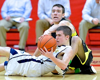 Jeff Lange | The Vindicator  Devils' Anthony Pugh (front) fights with Bristol's Bryce Gabrielsson (back) for possession of the ball early in the third period of Saturday's game at Struthers as part of the Hope Classic Showcase.
