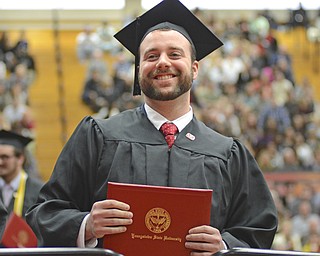 Katie Rickman | The Vindicator.David William Berry smiles at family members after receiving his  Bachelor of Engineering degree at commencement at Youngstown State University on Sunday, Dec. 14, 2014 at the Beeghly Center.