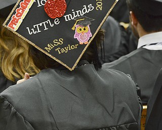 Katie Rickman | The Vindicator.Taylor Richards sports a decked out graduation cap during commencement at Youngstown State University on Sunday, Dec. 14, 2014 at the Beeghly Center.