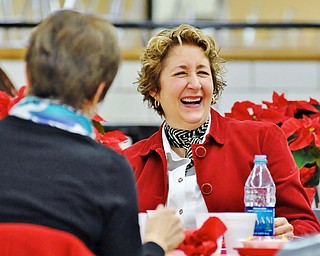 Jeff Lange | The Vindicator  Former 2nd grade teacher at Hilltop Elementary School, Nanette Midgley of Boardman laughs with friends while eating her breakfast at Canfield High School during the appreciation breakfast.