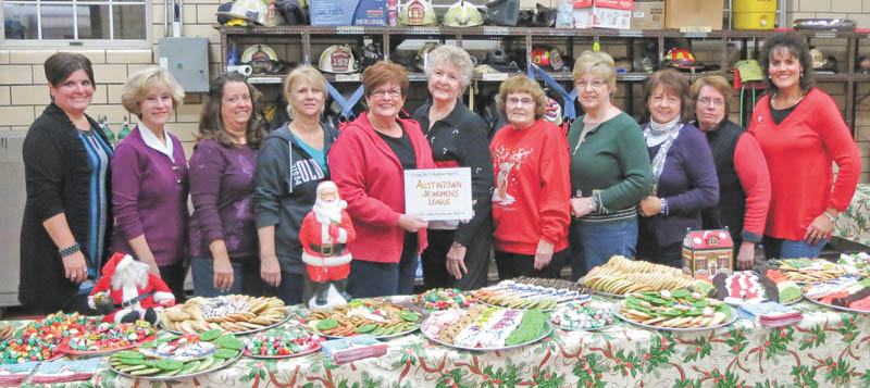 SPECIAL TO THE VINDICATOR: 
The Austintown Junior Women’s League recently helped serve cookies and cocoa to hundreds of children with Joyce Pogany and the Wickliffe Circle Christmas Committee at the Wickliffe Fire Station. The community Christmas tree was lit, and Santa arrived on a fire truck while the Austintown Fitch Brass Band performed Christmas carols. Those serving, from left, are Janet Polish, Kathy Mock, MaryAnn Herschel, Mary Toporcer, Kathy Rusback, Pogany, Shirley Schmidt, Janice Simmerman, Sue Hovanec, Deanna Hosey and Ruty Rodriguez Patterson.