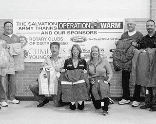 SPECIAL TO THE VINDICATOR: Local Rotary clubs gathered to distribute new coats to children on Dec. 6 at Salvation Army on Glenwood Avenue. The Rotary clubs of Austintown, Boardman, Canfield, Poland, Struthers and Youngstown sponsored the event. Above are Rotary members who helped distribute the coats. From left to right are Robert McFarland, Ron Carroll and Gary Reel from Austintown Rotary; Sam Boak, Donna Boak and Nancy Ramunno from Canfield Rotary; Chuck Cole and Mark Cole from Austintown Rotary; and Tom Fusco from Canfield Rotary.