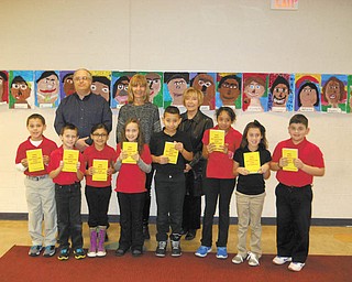SPECIAL TO THE VINDICATOR: The Struthers Rotary is continuing its participation in the Dictionary Project by donating dictionaries to third-grade students in Struthers, Campbell, Lowellville and St. Nicholas School in Struthers. Standing with some of the third-graders from Campbell are, from left, Tom Baringer, Rotarian; Karen Carney, third-grade teacher; and Marge Diorio, Rotarian.