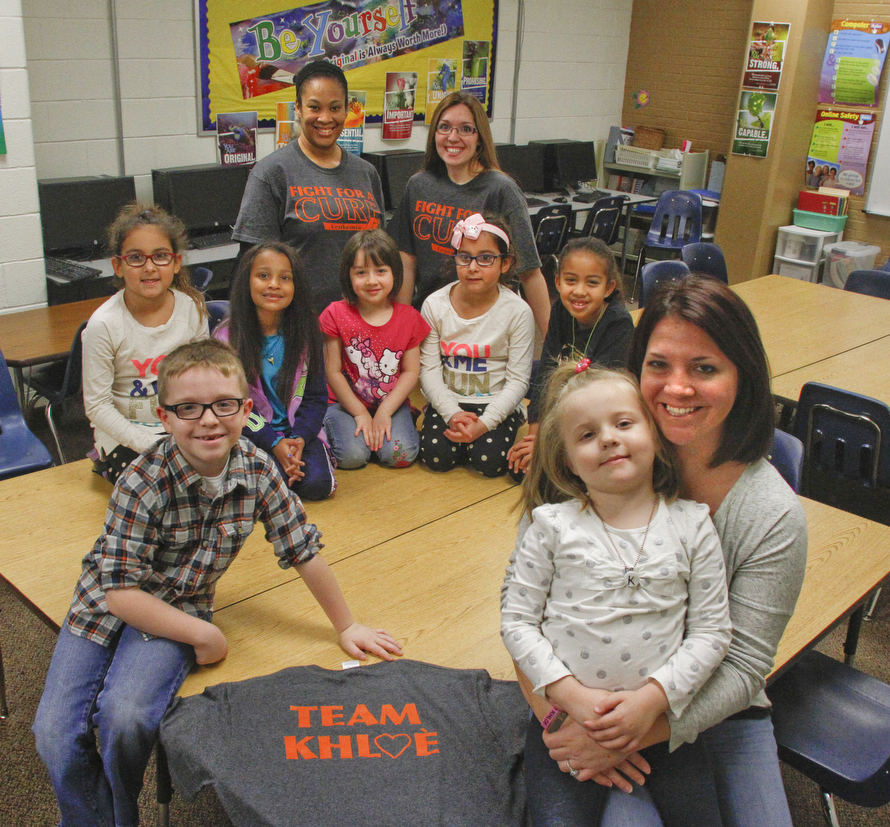        ROBERT K. YOSAY  | THE VINDICATOR..KHLOE Herrick 4.. a sister of one of the Akiva students has been diagnosed with leukemia and the school has been raising money to help..Khloe is on her mothers Lap ( Brittni (ok)- to the left is  her brother Camron (ok)..back row...  Addison SIlverman 1st grade- Lahna Jane Wall (k) Hannah Uplinger (k) Cameron (ok) silverman (1)and Selah Sargent (1).teachers are  Denitra Hamner and  Amanda Hugli.