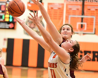 NEW MIDDLETOWN, OHIO - DECEMBER 15, 2014: Sara Durr #30 of South Range goes for the block of Callie Ford #11 of Springfield's shot during the 1st half of Monday nights game at Springfield High School. (Photo by David Dermer/Youngstown Vindicator)