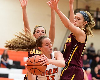 NEW MIDDLETOWN, OHIO - DECEMBER 15, 2014:Mary Ritter #13 of Springfield attempts to escape the pressure of Madison Durkin #13 and Ashley Sharp #10 of South Range during the 1st half of Monday nights game at Springfield High School. (Photo by David Dermer/Youngstown Vindicator)