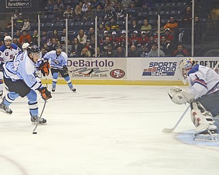 Katie Rickman | The Vindicator.Phantom's Kiefer Sherwood (44) scores against Team USA's Michael Lackey (1) during the first period during the game at the Covelli Centre on Dec. 19, 2014.