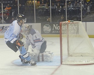Katie Rickman | The Vindicator.Phantom's Kiefer Sherwood (44) scores against Team USA's Michael Lackey (1) during the first period during the game at the Covelli Centre on Dec. 19, 2014.