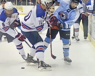 Katie Rickman | The Vindicator.Phantom's MAt Alvaro (91) and Team USA's Nicholas Boka (10) go up against one another as Team USA's Mike Floodstrand (16) comes up from behind during the first period on Friday, Dec. 19, 2014.