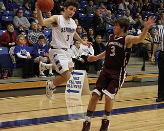 Poland's Nick Gajdos (3) tries to save the Bulldog possession by throwing the ball at Boardman's Brian Fryda (3) before landing out of bounds during the first half of Friday nights matchup at Poland Seminary High School. Dustin Livesay  |  The Vindicator  12/19/14  Poland Seminary High School.