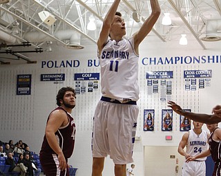 Poland's Matt Baker (11) puts up a shot during the first half of Friday nights matchup against Boardman High School at Poland Seminary High School. Dustin Livesay  |  The Vindicator  12/19/14  Poland Seminary High School.