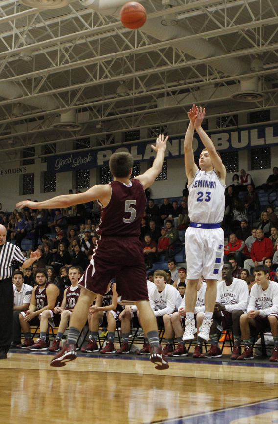 Poland's Jared Buckert (23) shoots a 3-pointer over Boardman's Alex Duda (5) during the first half of Friday nights matchup at Poland Seminary High School. Dustin Livesay  |  The Vindicator  12/19/14  Poland Seminary High School.