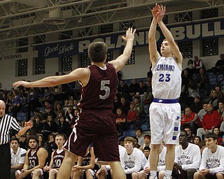 Poland's Jared Buckert (23) shoots a 3-pointer over Boardman's Alex Duda (5) during the first half of Friday nights matchup at Poland Seminary High School. Dustin Livesay  |  The Vindicator  12/19/14  Poland Seminary High School.