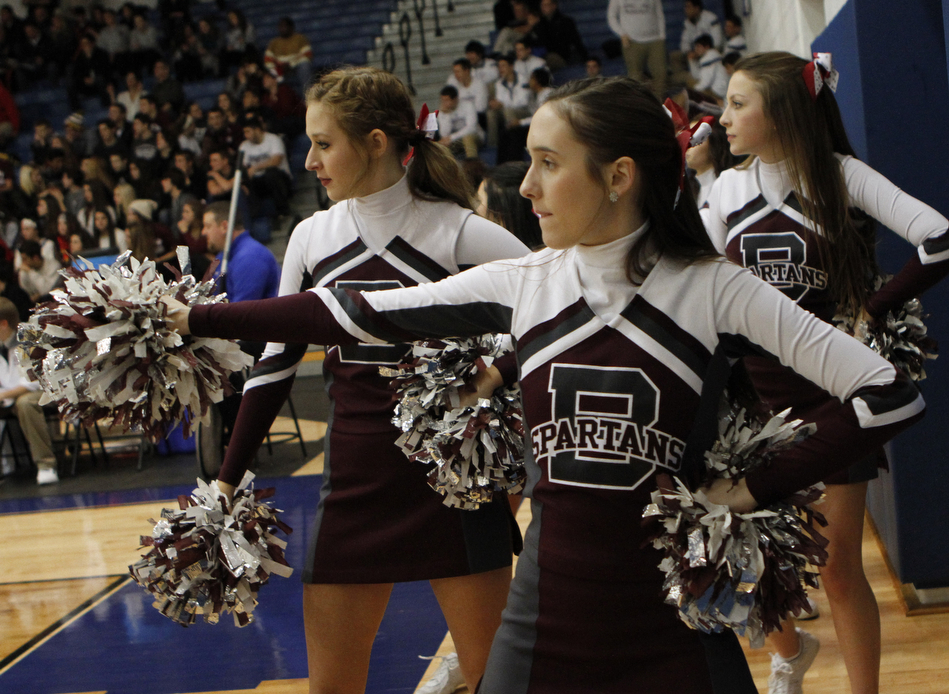 Senior Mimi Shorokey of the Boardman High School cheerleading squad cheers on the sidelines during the first half of Friday nights matchup against Poland at Poland Seminary High School. Dustin Livesay  |  The Vindicator  12/19/14  Poland Seminary High School.