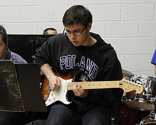 Poland's Michael Carney plays guitar during halftime of Friday nights matchup against Boardman High School at Poland Seminary High School. Dustin Livesay  |  The Vindicator  12/19/14  Poland Seminary High School.