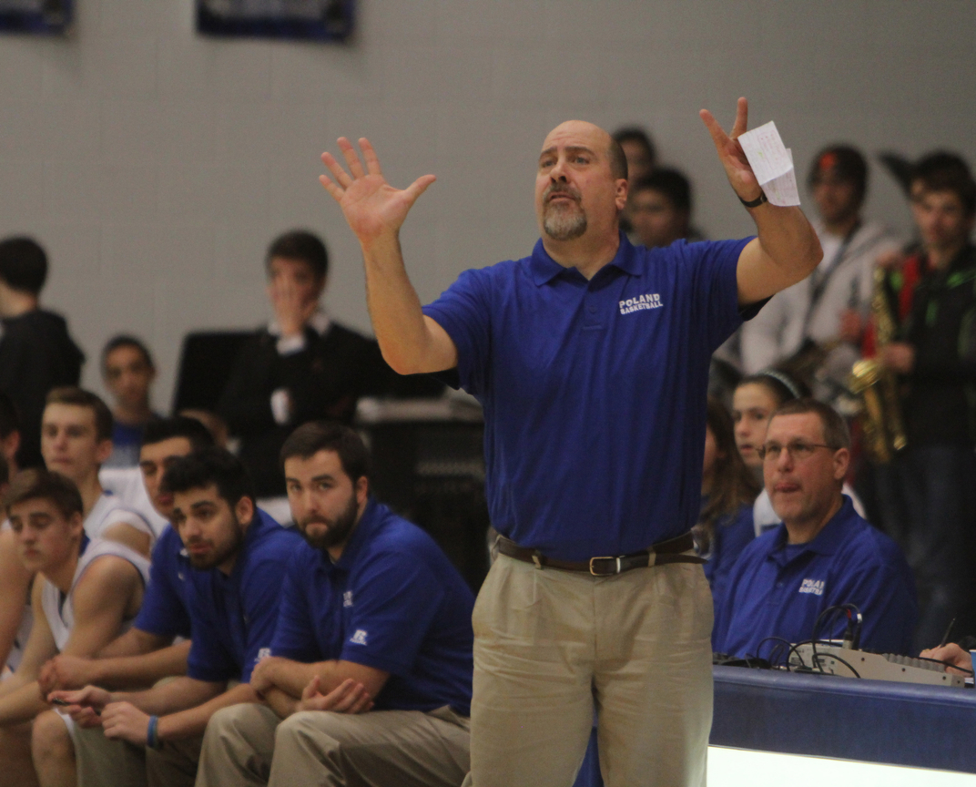 Poland coach Ken Grisdale calls out plays to his team during the first half of Friday nights matchup against Boardman High School at Poland Seminary High School. Dustin Livesay  |  The Vindicator  12/19/14  Poland Seminary High School.